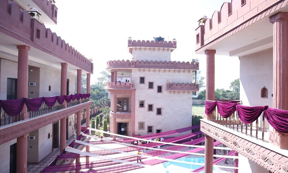 Courtyard view of The Fort with balconies and tower